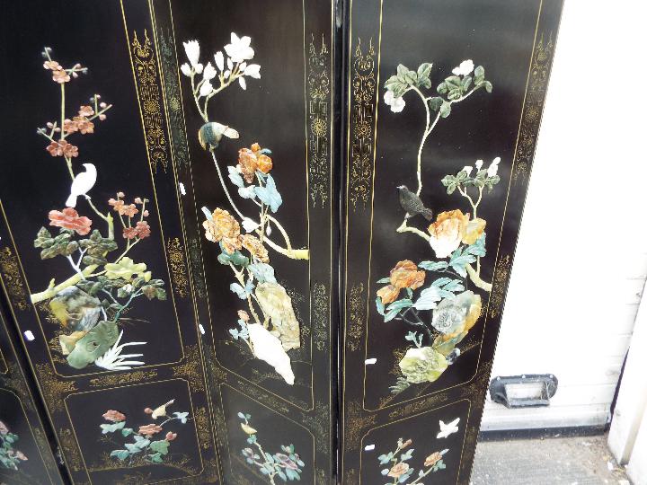 A large black lacquer, six leaf screen measuring approximately 183 cm x 240 cm. - Image 4 of 5