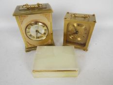 Two carriage clocks, largest 17 cm (h) and an onyx trinket box.