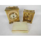 Two carriage clocks, largest 17 cm (h) and an onyx trinket box.