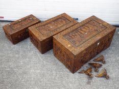 A set of three graduated, highly carved camphor wood chests,