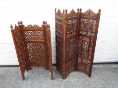 Two highly carved Asian screens, the largest approximately 124 cm x 99 cm.