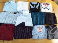 A job lot of 12 gentlemen's shirts, various adult sizes,