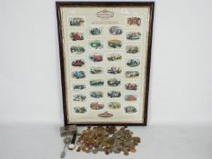 A framed set of Castella Donington Collection collectors cards, a quantity of UK and foreign coins,