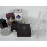 A collection of glassware, part boxed to include vase, decanters, glasses and similar.