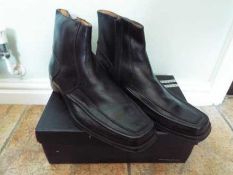 A pair of black leather ankle boots, size 42 (EU), 8 (UK),