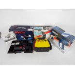 Lot to include a Bosch cordless angle grinder, Draper hot air gun, air compressor and similar.