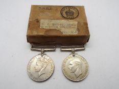 A World War Two (WW2 / WWII) medal pair comprising Defence Medal and British War Medal in box of