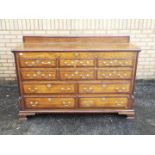 A sideboard with hinged lid enclosing st