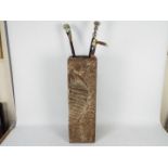 A stick / umbrella stand with a small qu