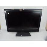 A 32" Toshiba Regza LCD television, model 32WLT66s, with remote.