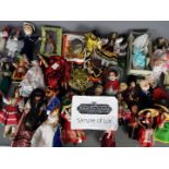A box of international costume dolls and similar.