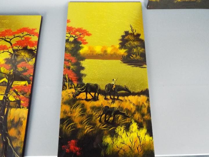Four lacquered panels, landscape scenes with buffalo, each approximately 59 cm x 29 cm. - Image 3 of 4