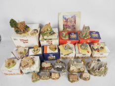 A collection of Lilliput Lane models, predominantly boxed.