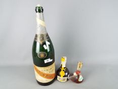 A vintage 35 cl bottle of Grand Marnier Cordon Jaune (seal intact),
