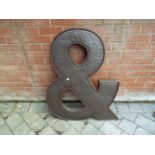 Decorative wall art - a metal ampersand