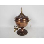 A brass mounted copper samovar with twin