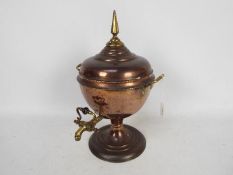 A brass mounted copper samovar with twin