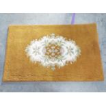 A hand made Indian rug with floral desig