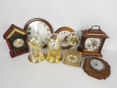 A box of various mantel and wall clocks and an oak cased barometer.