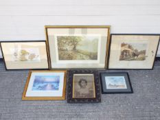 A collection of pictures, all framed, va