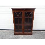 A twin door, astragal glazed bookcase, approximately 105 cm x 78 cm x 30 cm.