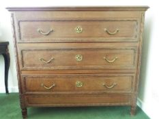 Chest of three drawers with brass drop handles,