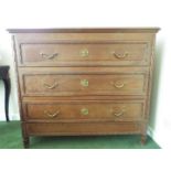 Chest of three drawers with brass drop handles,