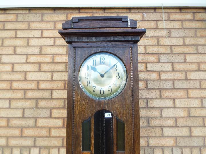 An early 20th century oak cased longcase clock, hour and half past gong striking movement, - Image 2 of 10