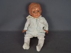 Ando Togoro - A large vintage Japanese celluloid jointed doll of a baby body.
