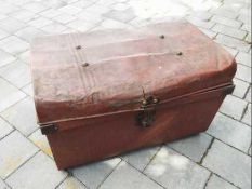 A hinge-lidded metal trunk