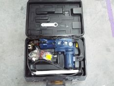 An unused powercraft 850 watt electric breaker with 2 breaker bits in case