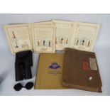 Lot to include cigarette card albums, 1937 Coronation souvenir book and a cased set of binoculars.