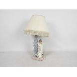 A Nao figural table lamp, approximately