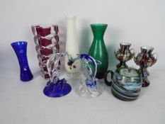 A collection of glassware, largest piece