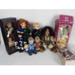 A collection of porcelain dressed dolls