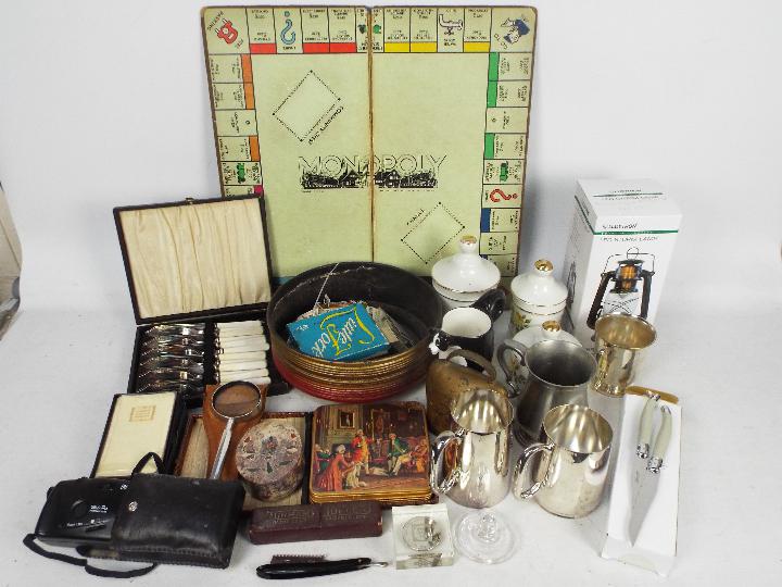 A mixed lot to include plated ware, flatware, tea cards, ceramics and similar.