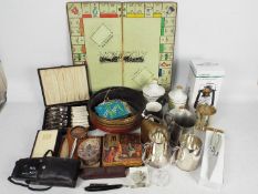 A mixed lot to include plated ware, flatware, tea cards, ceramics and similar.