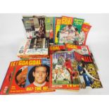 A collection of vintage Goal magazine issues and a quantity of football annuals.