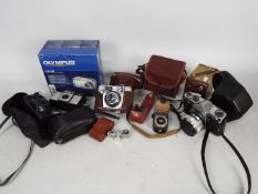 Photography - A collection of cameras to include Yashica, Halina, Pentax, Olympus and other.