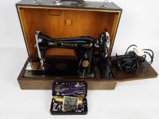 A Singer Sewing Machine with many access