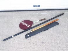 Two vintage snooker cues in carry cases and a vintage Dunlop Blue Flash Junior tennis racket.