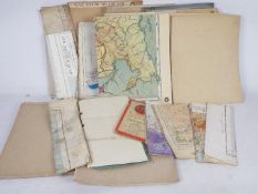 A box of vintage wall maps.