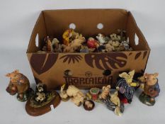 A box of Piggin and similar figurines.