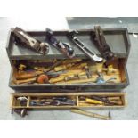 A vintage tool chest containing a quantity of vintage hand tools.