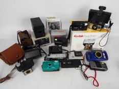 Photography - A collection of vintage cameras to include Kodak, Halina, Polaroid,