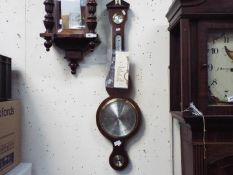 A Comitti banjo barometer.