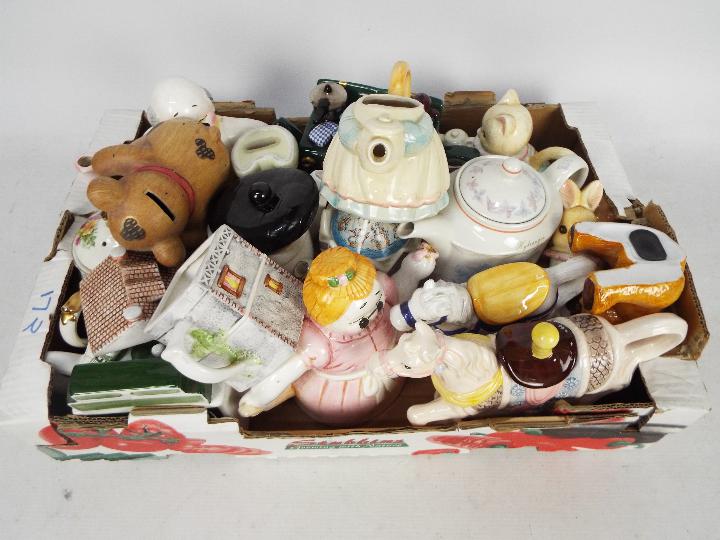 A collection of teapots, novelty teapots