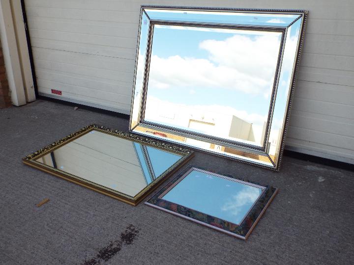 Three wall mirrors, largest approximatel