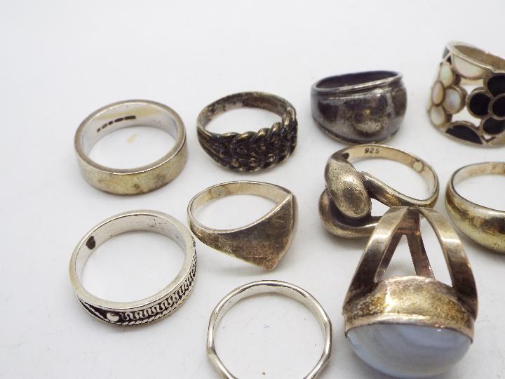 A collection of silver and white metal rings, various sizes. - Image 2 of 4