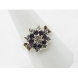 A 9ct yellow gold sapphire and white stone cluster ring, size Q, approximately 4.